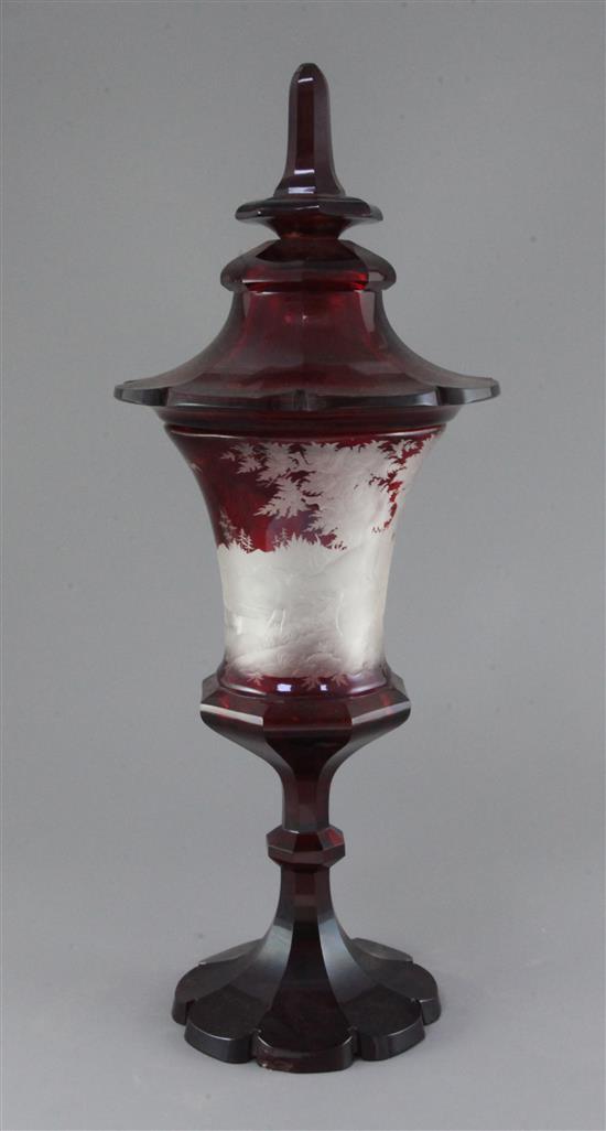 A large Bohemian ruby-stained glass cup and cover, mid 19th century, height 51 cm, finial re-fixed, shallow chips